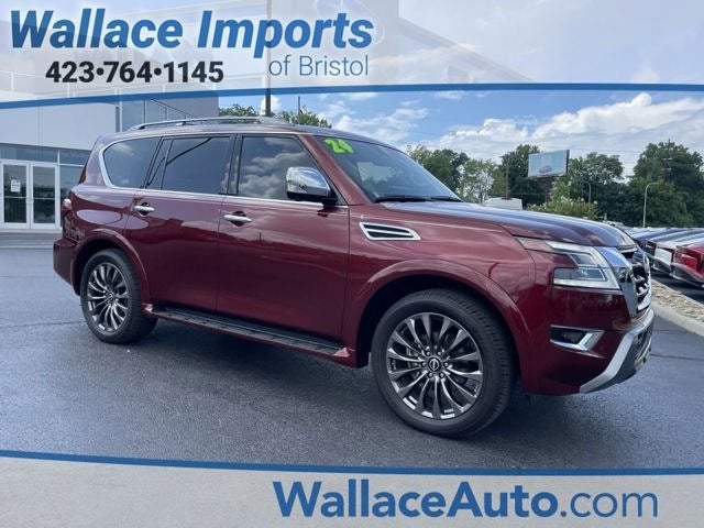 2024 Nissan Armada Platinum in Coulis Red Pearl — front three-quarter view