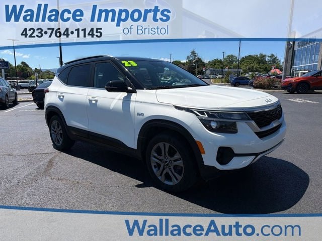 2023 Kia Seltos S in Clear White/Black Roof — front three-quarter view
